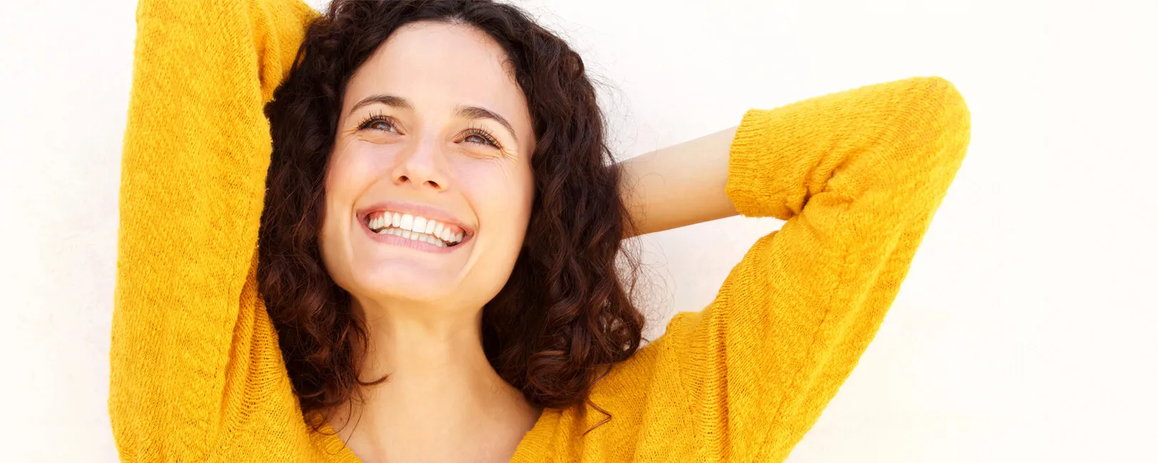 Happy Smiling Woman in a Yellow Sweater